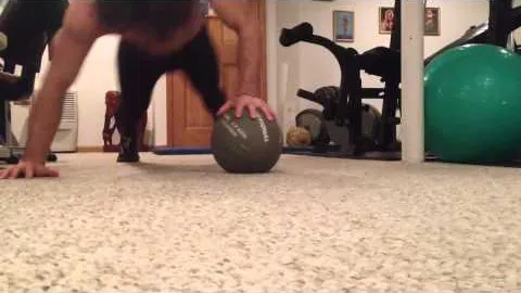 One-arm push-up on medicine ball